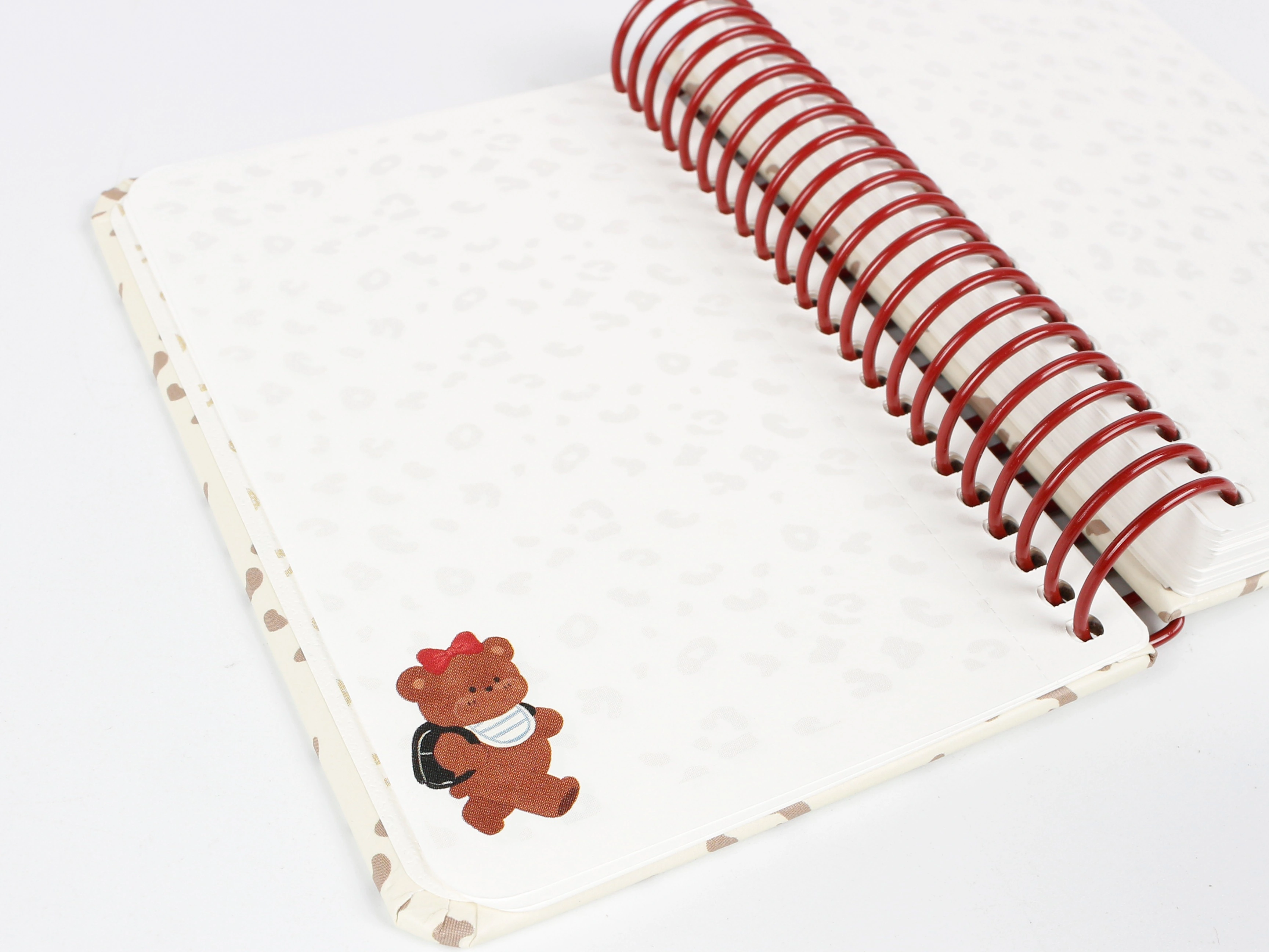 Custom notebooks with custom printed pages showing open spiral bound interior layout, customized ruling, and brand page margins for stationery manufacturing